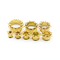 Les tunnels de prise d'oreille de chair d'or lacent les bijoux perçants de corps d'or du bord 10mm